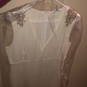 Brand new white sleeveless v cut dress